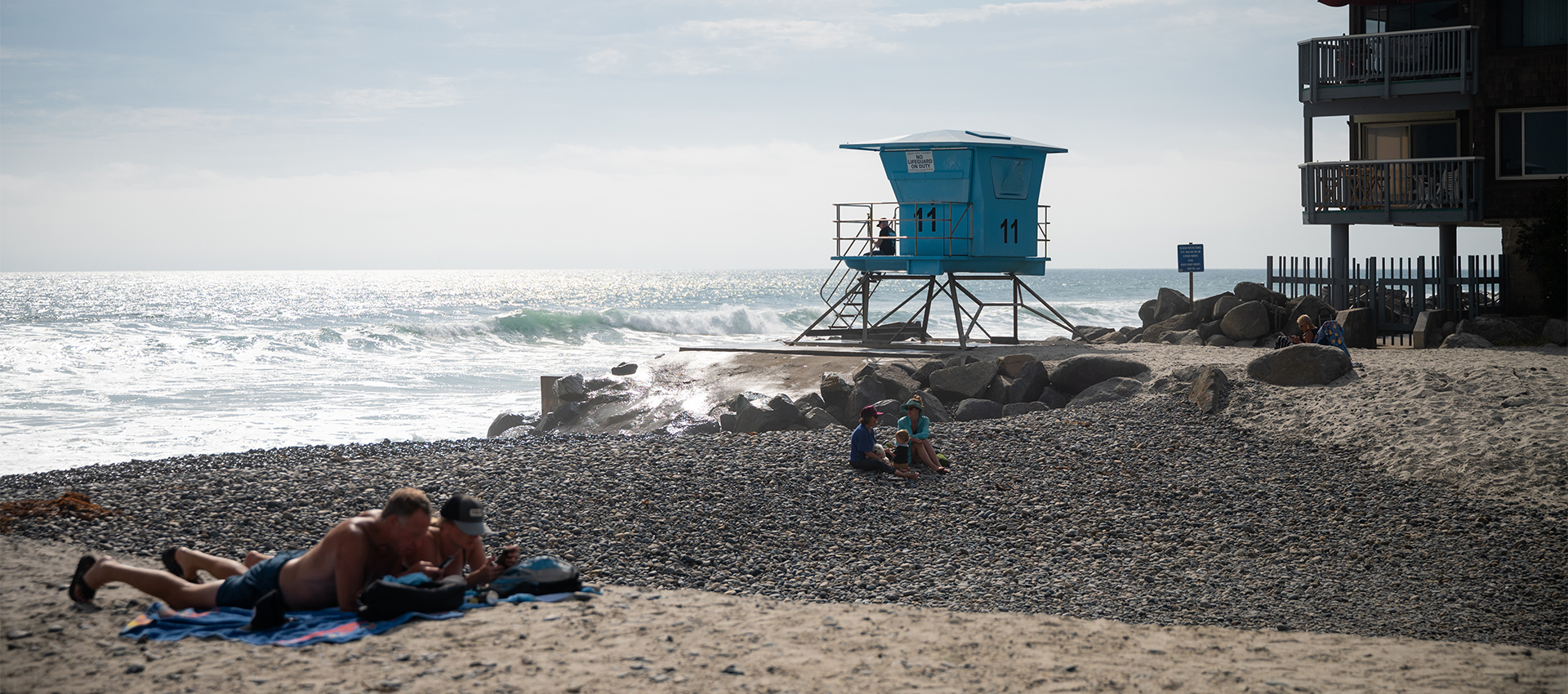 Couple relaxing on the beach in Oceanside CA 