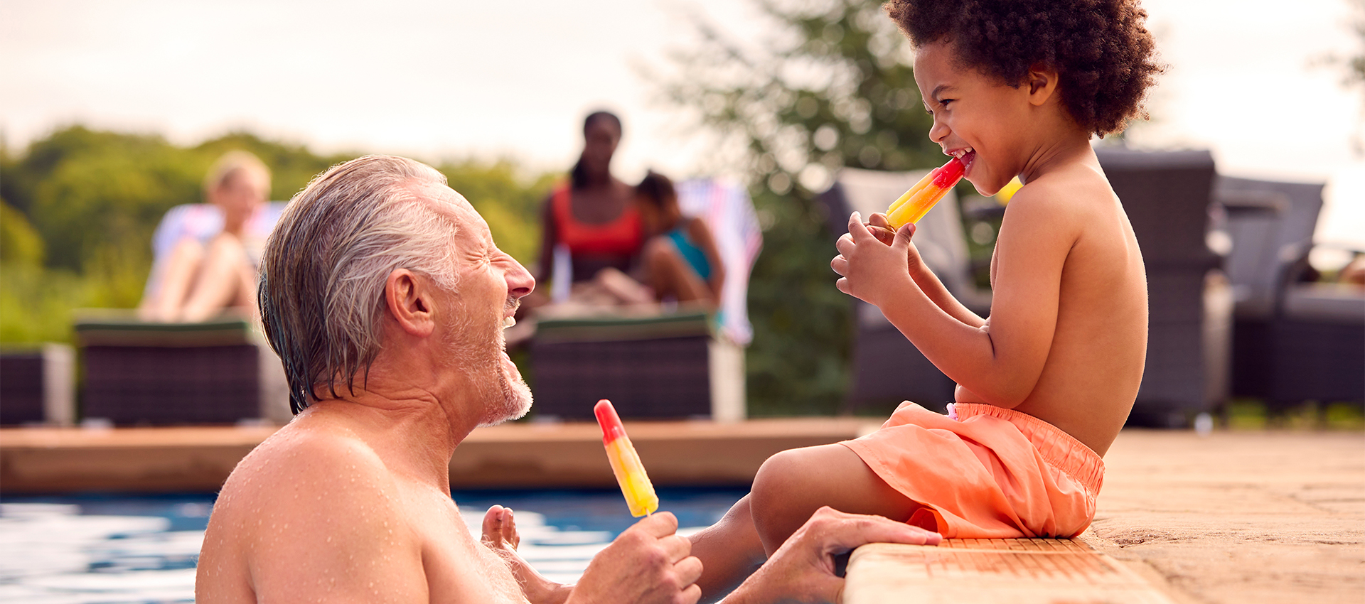 Grandfather and child at the pool