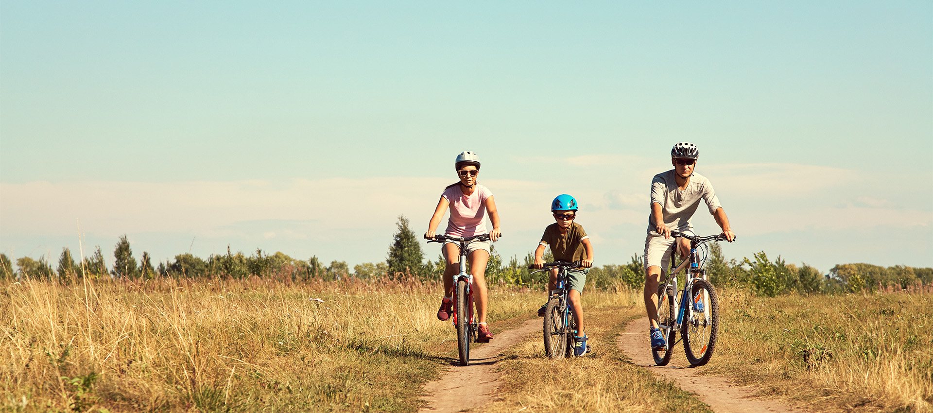 image of a family biking