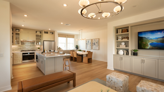 The kitchen, dining area, and Great Room at The Courts Plan 3 come together in a spacious, open-concept main living area. Designed to support everyday routines and entertaining, these connected spaces create a natural flow throughout the home while providing room to cook, gather, dine, and relax.
